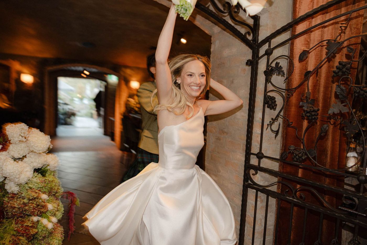 Bride making a joyful entrance into her reception
