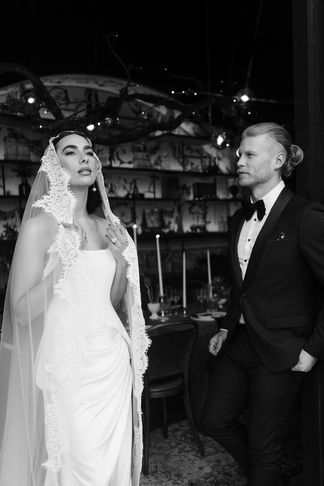 Bride in a lace mantilla veil with her groom